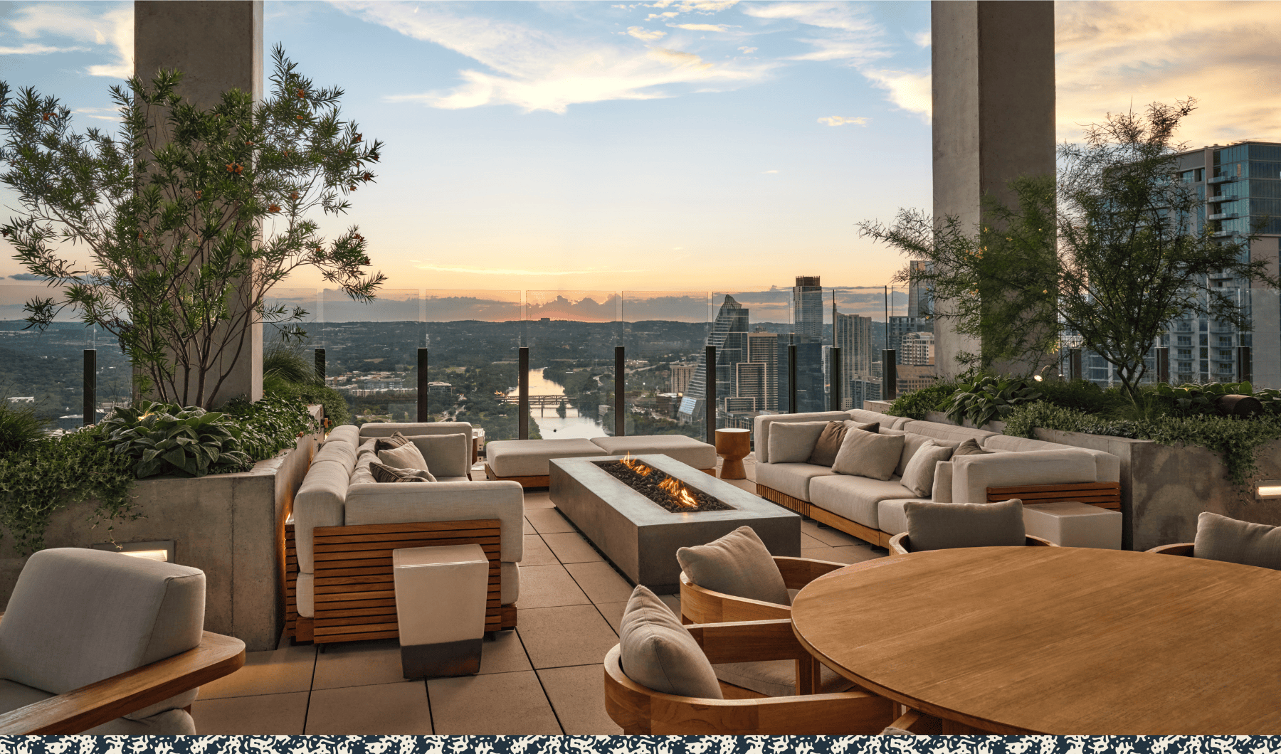 A club terrace high above the city at dusk